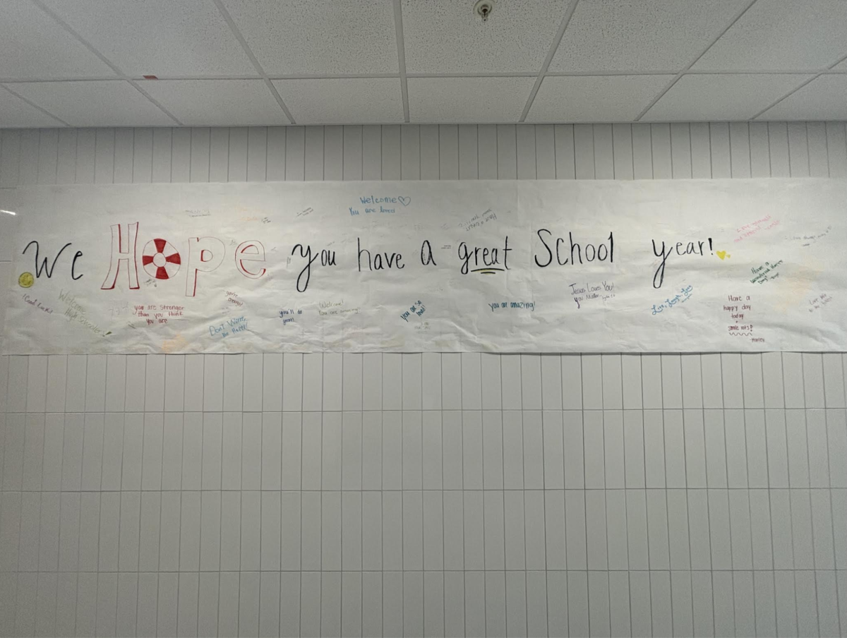 Hope Squad proudly displays their 'Hope Banner' outside of the cafeteria. The banner is filled with positive affirmations written by students and staff alike to help students feel connected and seen in our school. 